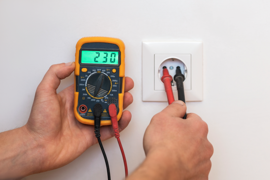voltage-measurement-by-tester-socket-electrician-technician-measures-voltage-with-tester