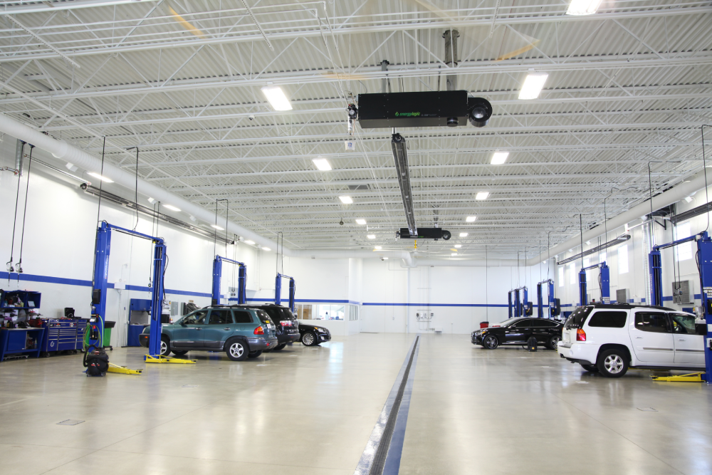 modern-vehicle-service-center-interior-with-blue-car-lifts